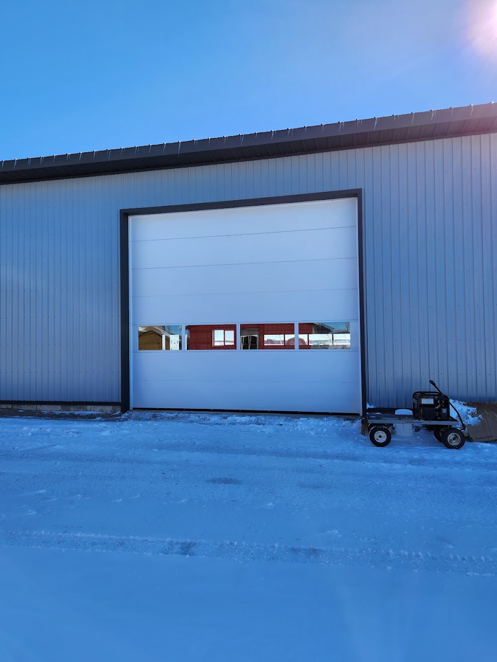 Eze-Trak Overhead Doors | 522357 Con 12 NDR RR #3, Elmwood, ON N0G 1S0, Canada | Phone: (519) 588-8899