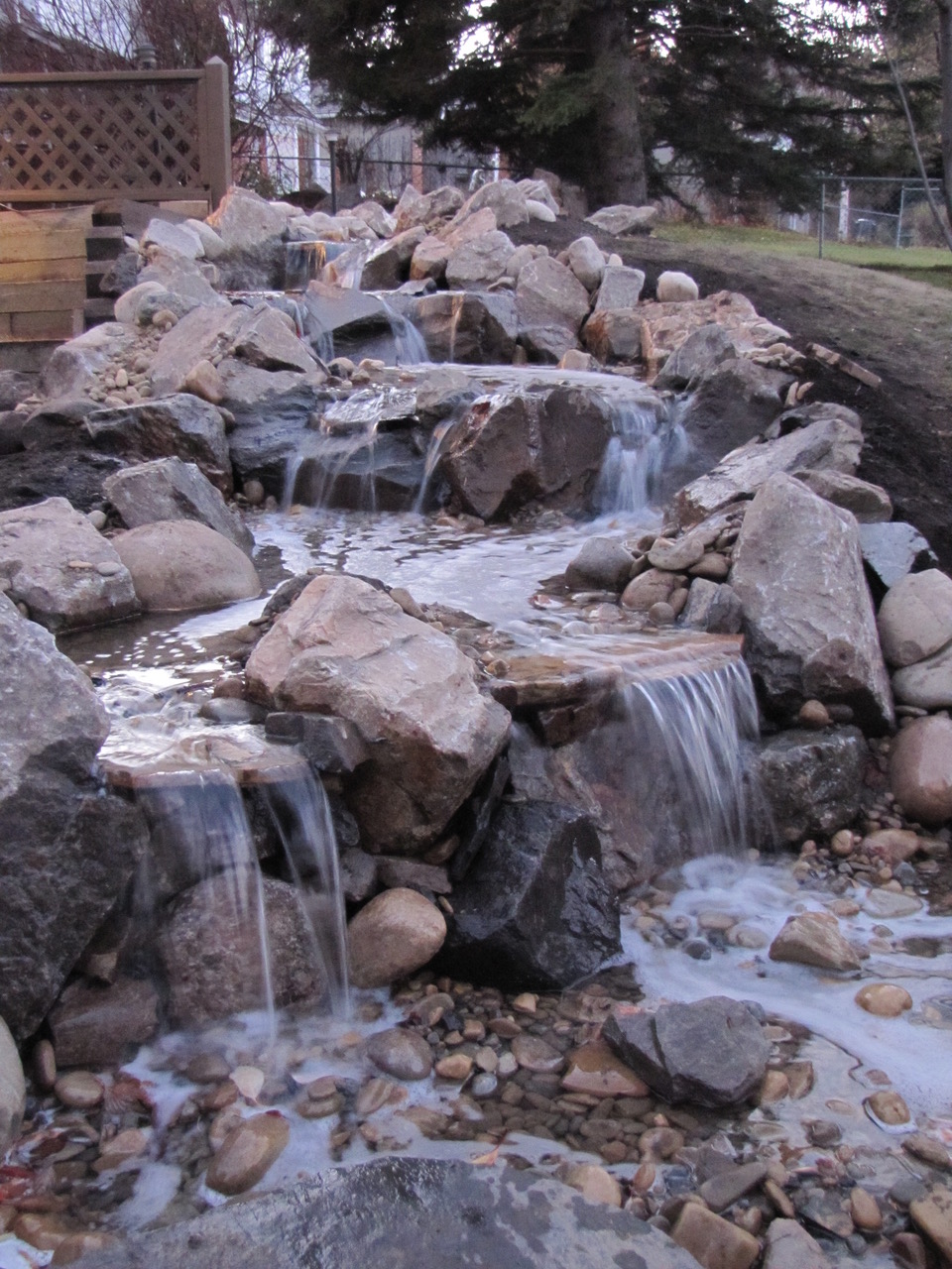 Babbling Brooks Ponds & Waterfalls | 224 Initiative Ave SE, Calgary, AB T3S 0B7, Canada | Phone: (403) 255-6070