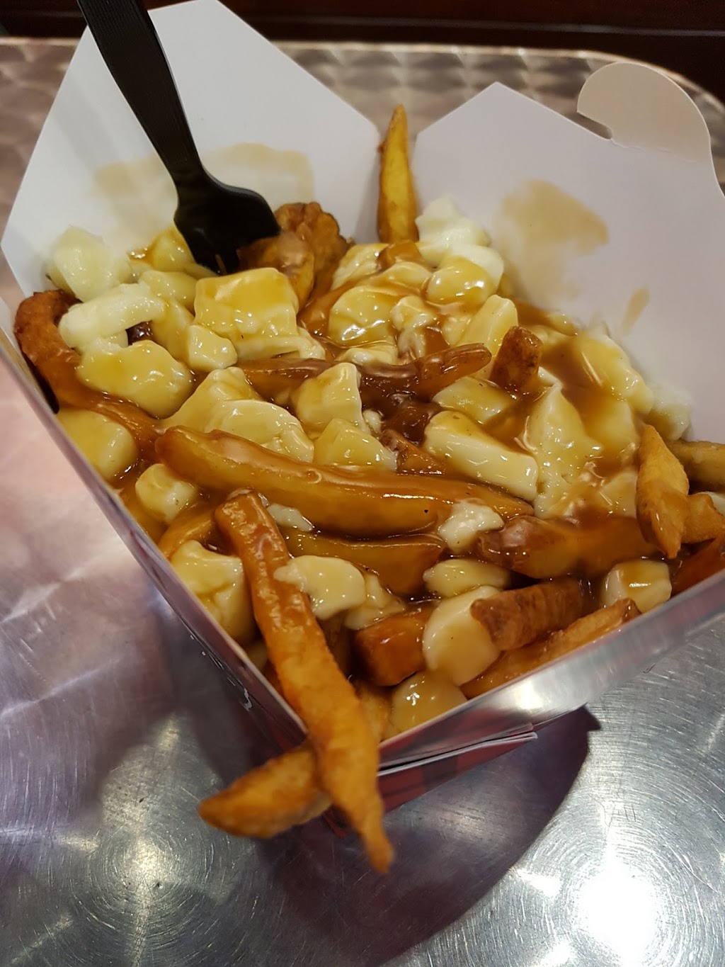 Smokes Poutinerie | 116 Atlantic Ave, Toronto, ON M6K 1X9, Canada | Phone: (647) 748-2873