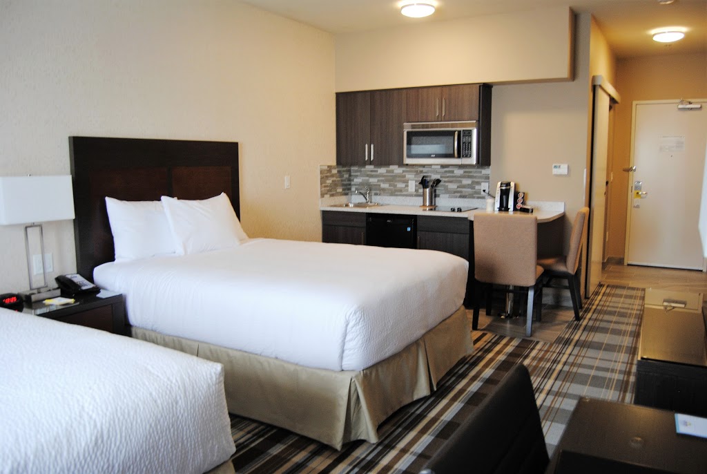 Days Inn & Suites by Wyndham Airdrie | 911 Highland Park Cove Northeast, Airdrie, AB T4A 0R2, Canada | Phone: (587) 600-0297